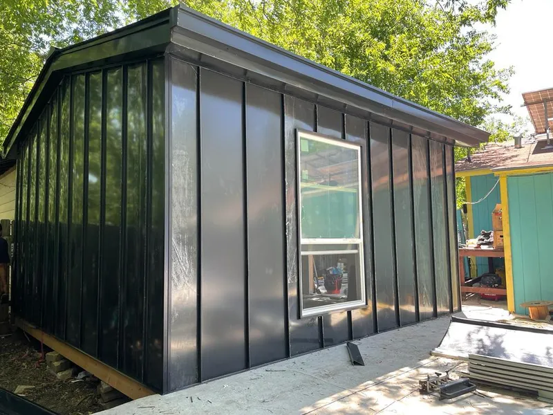 Black standing seam metal wall panels for Roof Inspection in Jacksonville